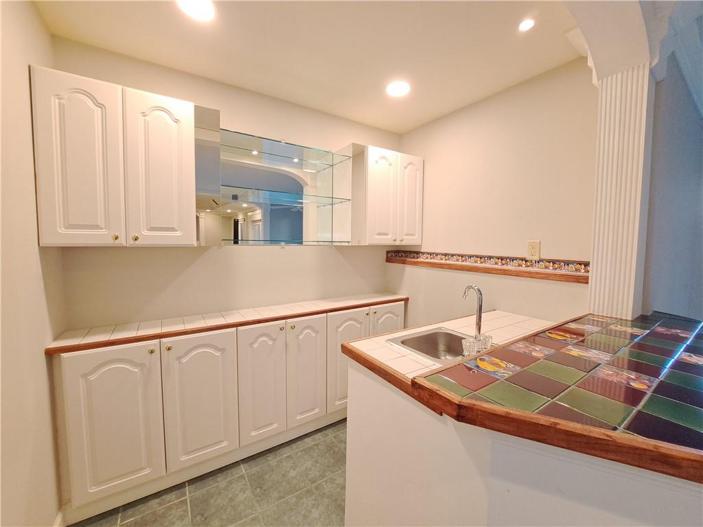 2242 Lenox Walk Northeast Atlanta, GA 30319 - Photo 67 of 80 a kitchen with stainless steel appliances granite countertop a sink and a white cabinets