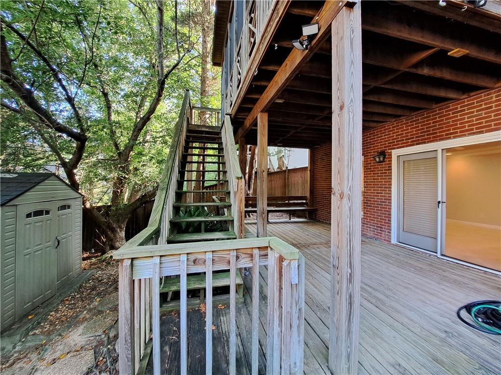 2242 Lenox Walk Northeast Atlanta, GA 30319 - Photo 72 of 80 a view of balcony with wooden floor and fence