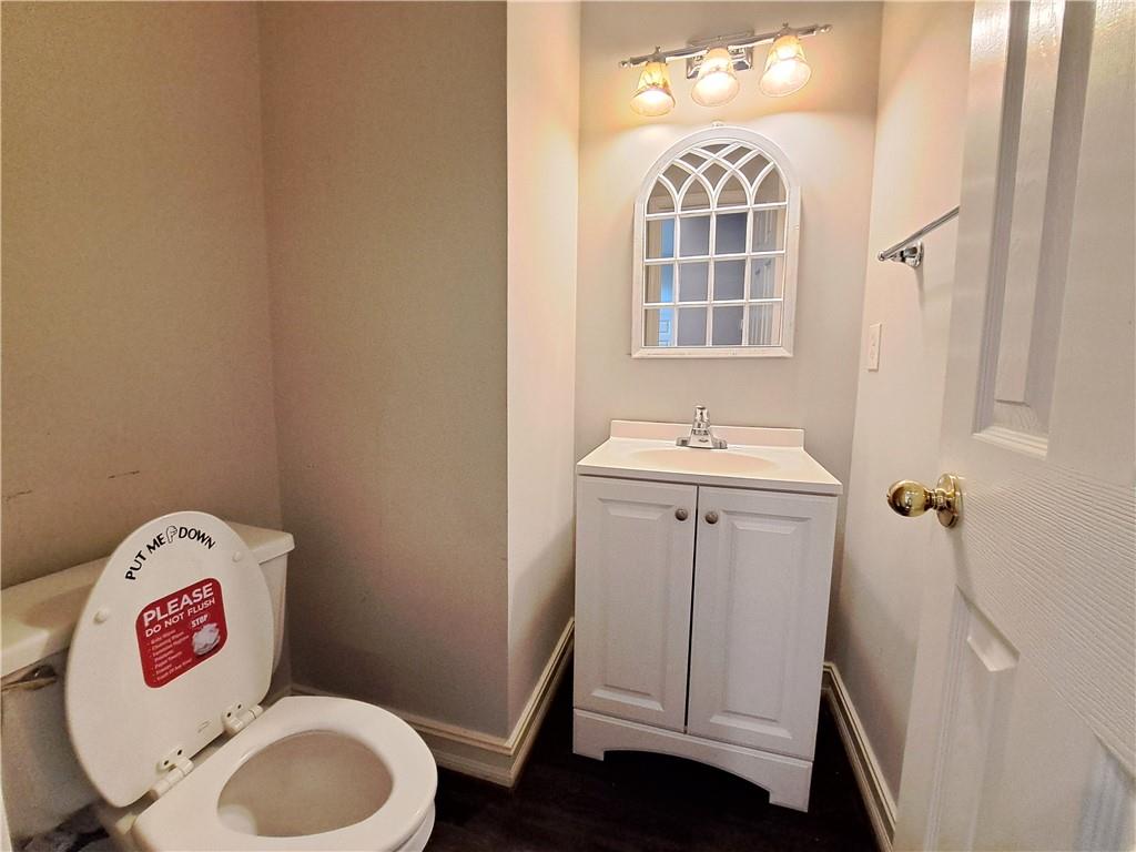 2242 Lenox Walk Northeast Atlanta, GA 30319 - Photo 10 of 80 a bathroom with a toilet sink and mirror
