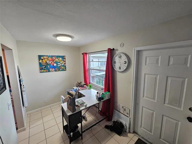 a room with a table and a clock