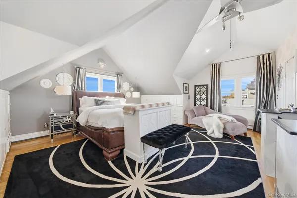 a room with furniture and kitchen view