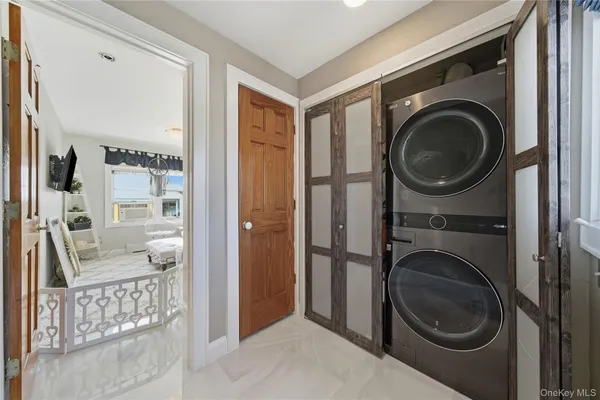 a view of a hallway with washer and dryer