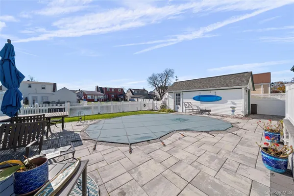 a view of swimming pool with outdoor seating and a terrace