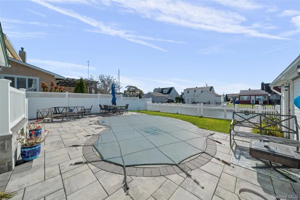 a view of outdoor space with swimming pool and lounge chair