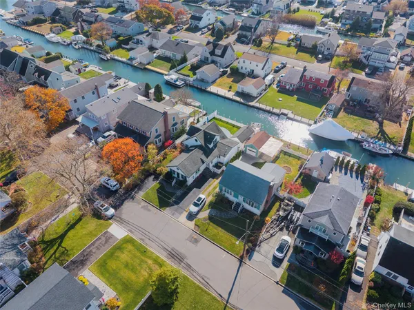 an aerial view of a houses with a swimming pool