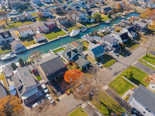 an aerial view of a pool patio outdoor seating and outdoor kitchen