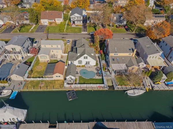 an aerial view of a house with a ocean view