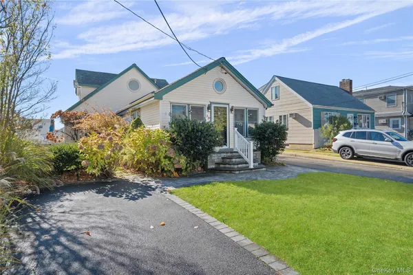 a view of a house with a yard porch and sitting area