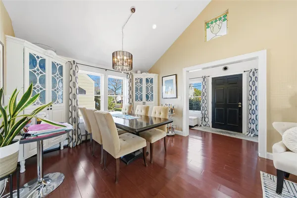 a living room with furniture or wooden floor and a chandelier