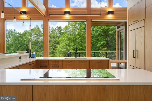 a bedroom with a large bed and a large window
