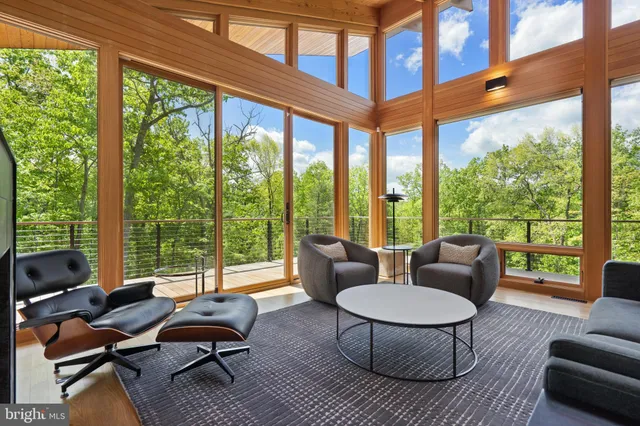 a view of living room with furniture and wooden floor