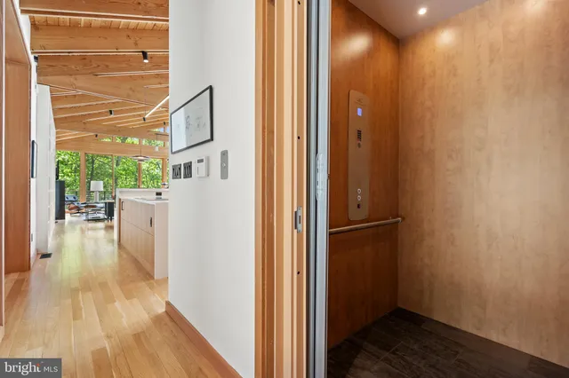 a bedroom with two beds and a large window
