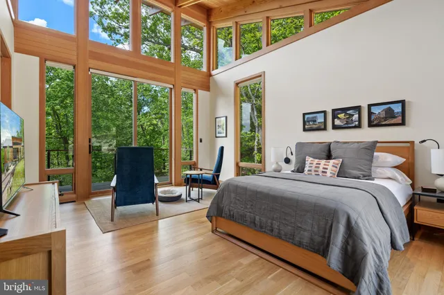 a bedroom with a bed and a couch