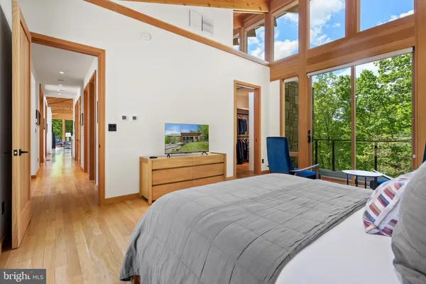 a bedroom with a bed and a couch