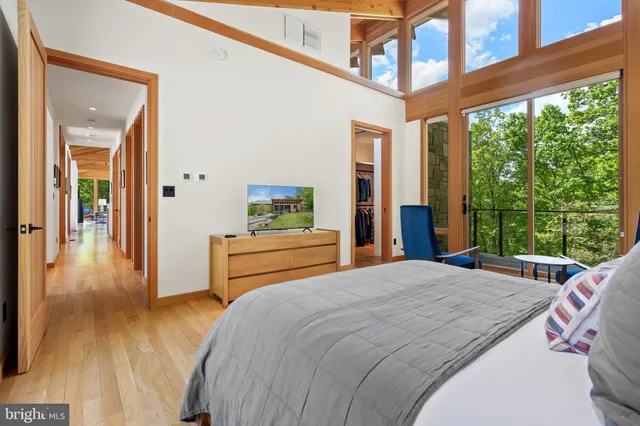 a bedroom with a bed and a couch