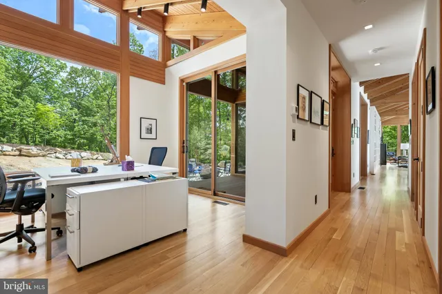 a backyard of a house with a yard and outdoor seating