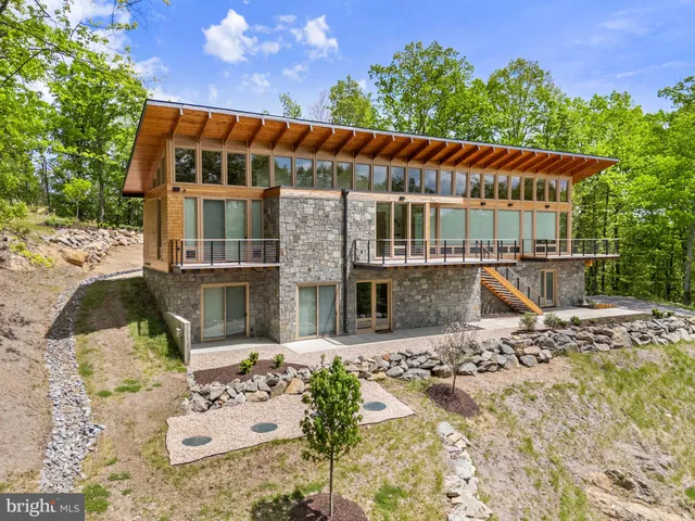 a view of a brick house with a large window