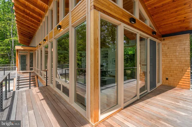 a front view of a house with a yard and seating space