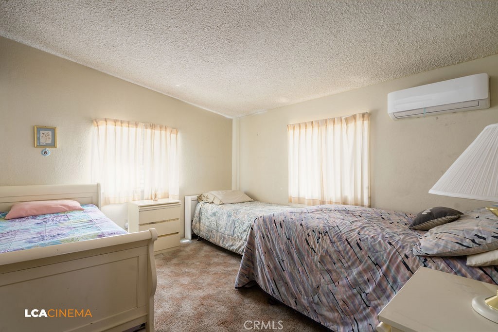 6004 Maple Avenue Mountain Mesa, CA 93240 - Photo 13 of 26 a bedroom with a bed and a window