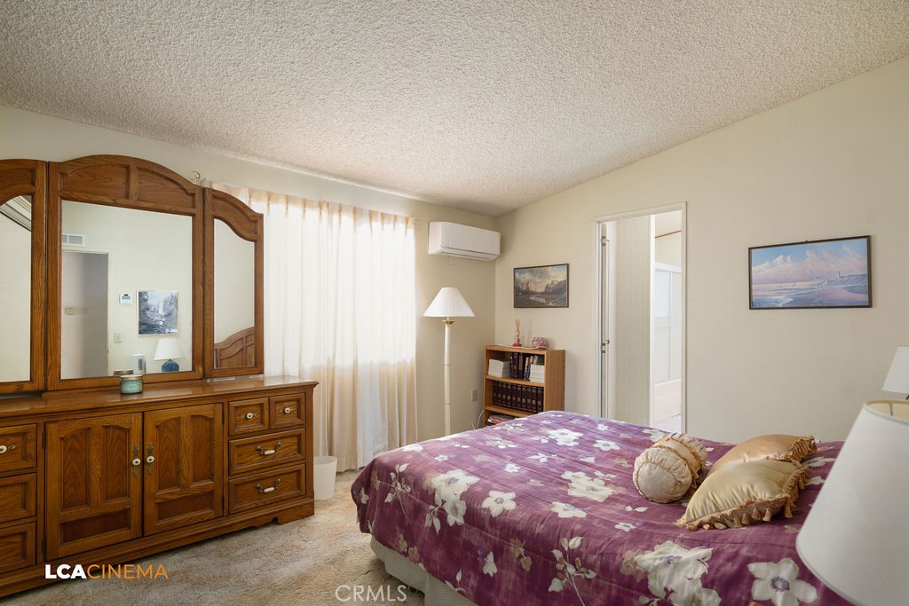 6004 Maple Avenue Mountain Mesa, CA 93240 - Photo 14 of 26 a bedroom with a bed and a dresser