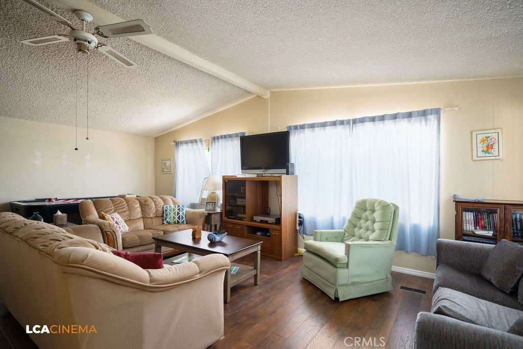 6004 Maple Avenue Mountain Mesa, CA 93240 - Photo 5 of 26 a living room with furniture and a flat screen tv