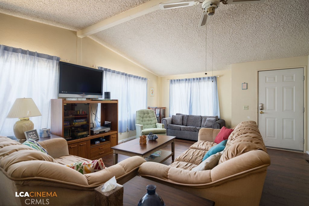 6004 Maple Avenue Mountain Mesa, CA 93240 - Photo 6 of 26 a living room with furniture and a flat screen tv