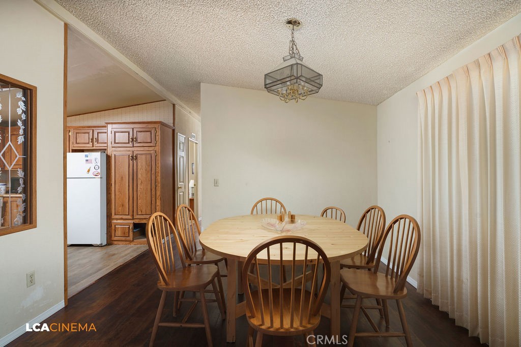 6004 Maple Avenue Mountain Mesa, CA 93240 - Photo 7 of 26 a view of a dining room with furniture window and wooden floor