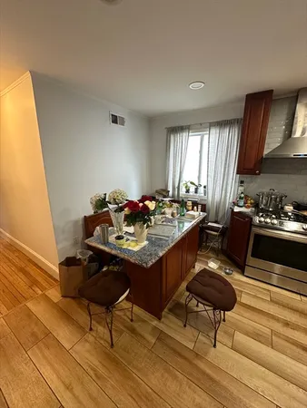a kitchen with a table and chairs in it