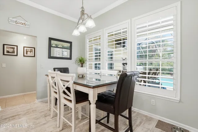 a view of a dining area with furniture window and outside view