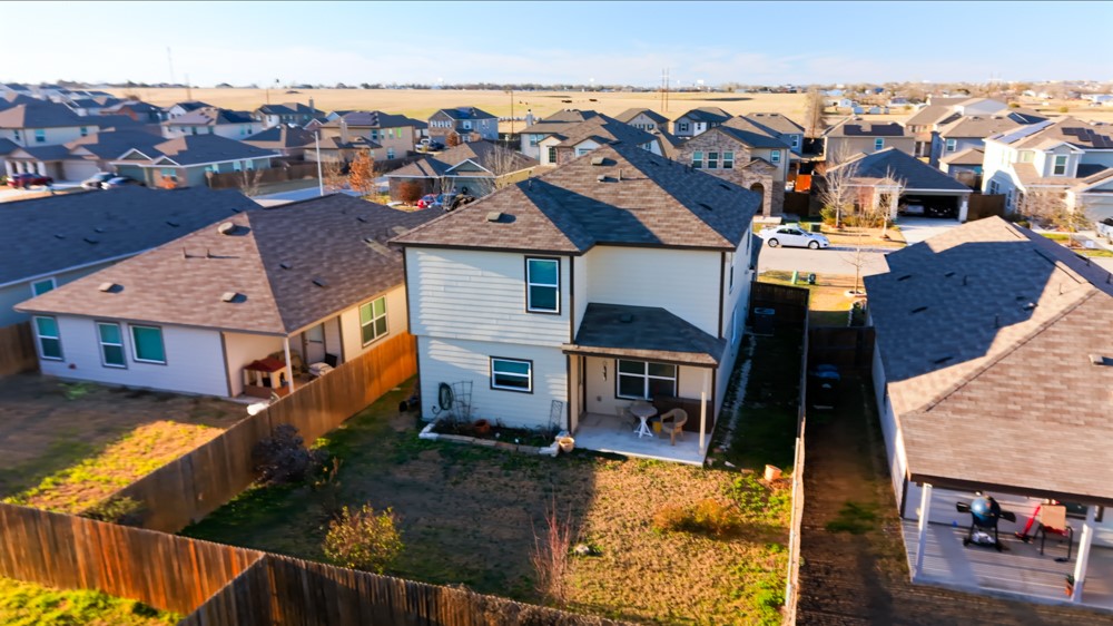 208 Greatest Gift Way Jarrell, TX 76537 - Photo 4 of 17 an aerial view of residential houses with outdoor space
