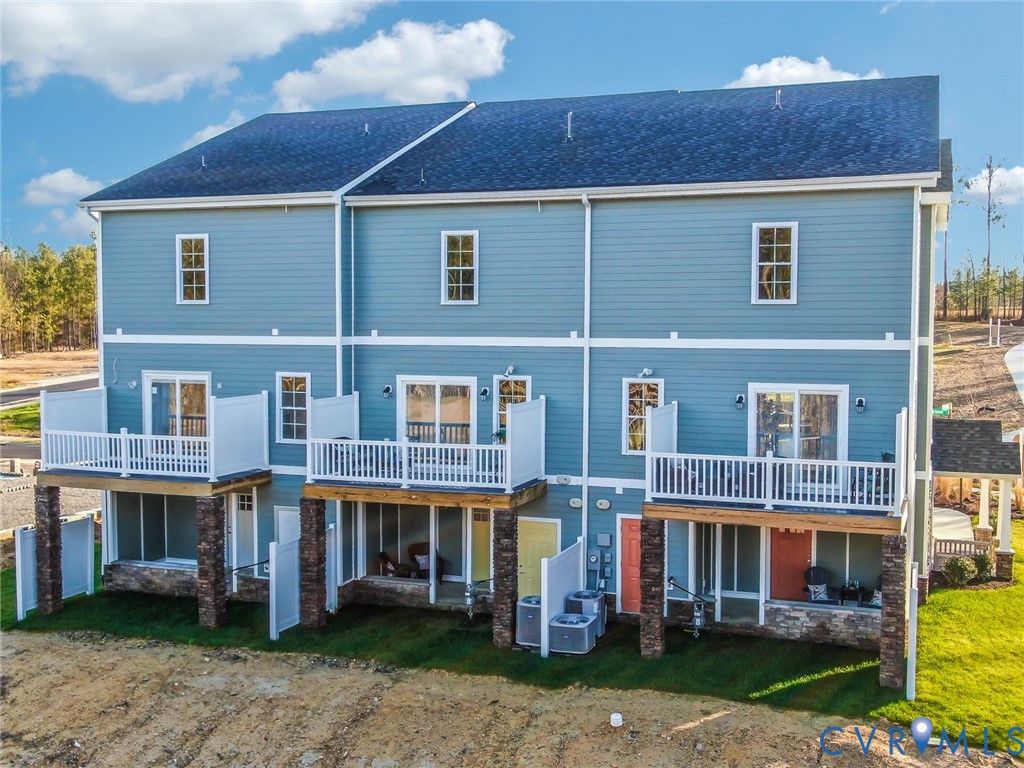 15305 Princess Lauren Lane Midlothian, VA 23112 - Photo 19 of 36 a large building with a small yard and trees in front of it
