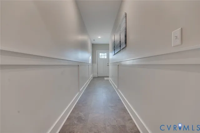 a view of a hallway with staircase