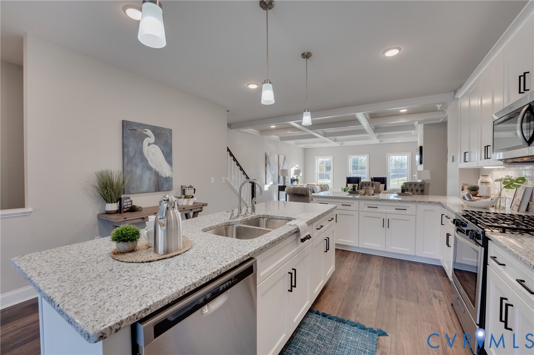 15305 Princess Lauren Lane Midlothian, VA 23112 - Photo 28 of 36 a kitchen with sink and stove