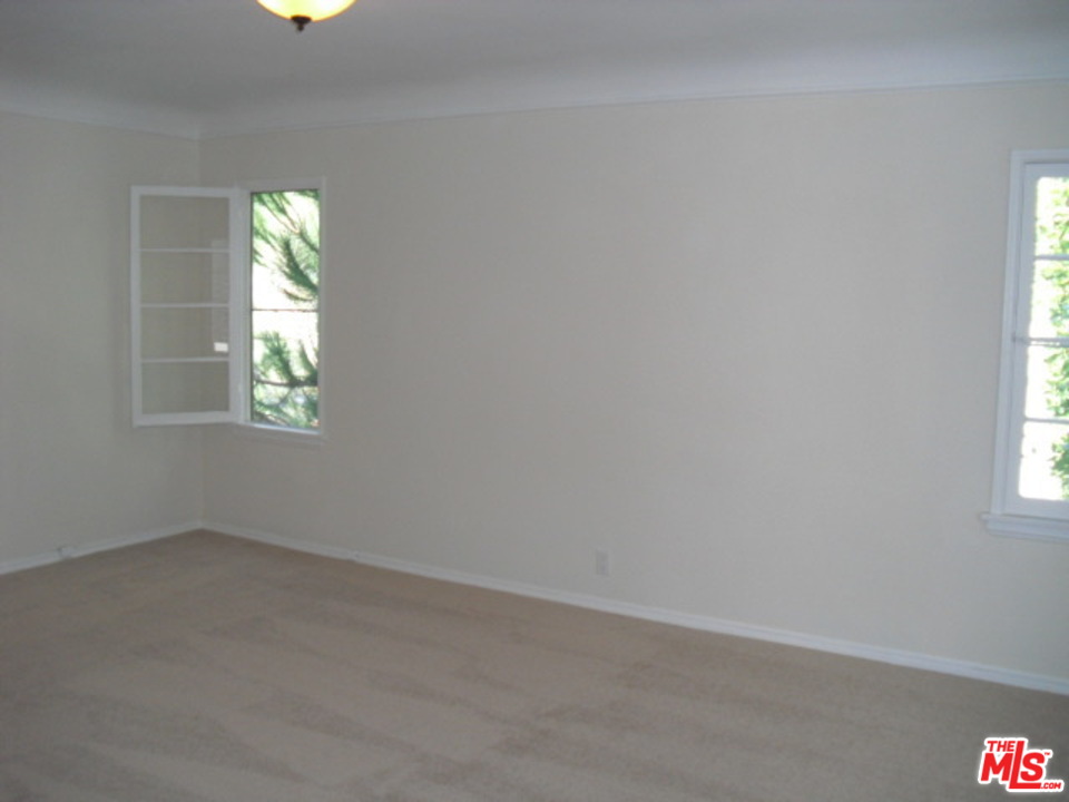 9963 Durant Drive Beverly Hills, CA 90212 - Photo 14 of 23 an empty room that has a window