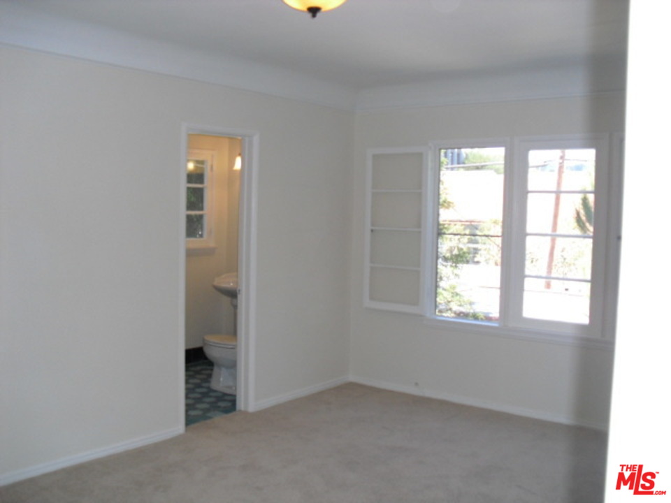 9963 Durant Drive Beverly Hills, CA 90212 - Photo 16 of 23 an empty room with windows