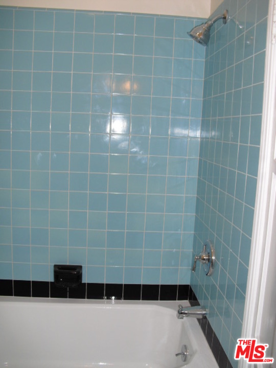 9963 Durant Drive Beverly Hills, CA 90212 - Photo 21 of 23 a bathroom with a shower
