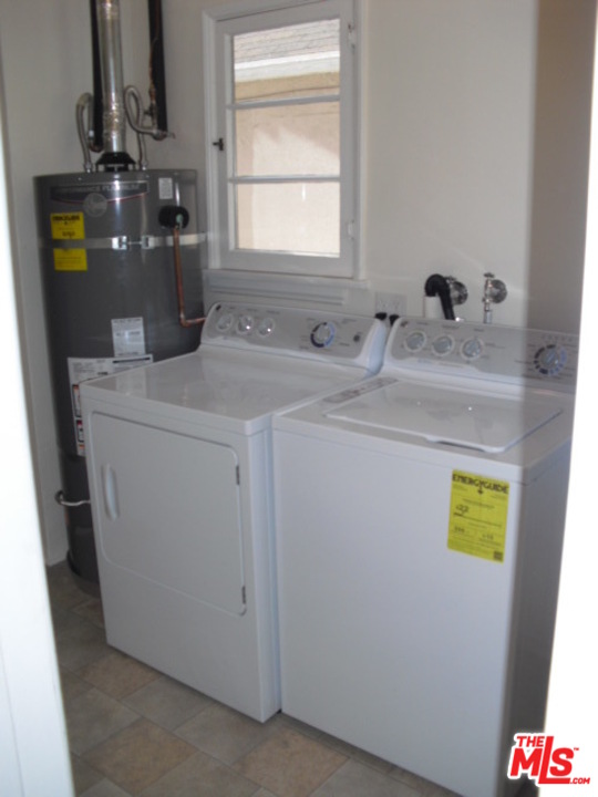 9963 Durant Drive Beverly Hills, CA 90212 - Photo 22 of 23 a bathroom with sink and mirror