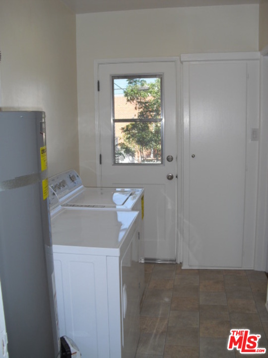 9963 Durant Drive Beverly Hills, CA 90212 - Photo 23 of 23 a utility room with dryer and washer
