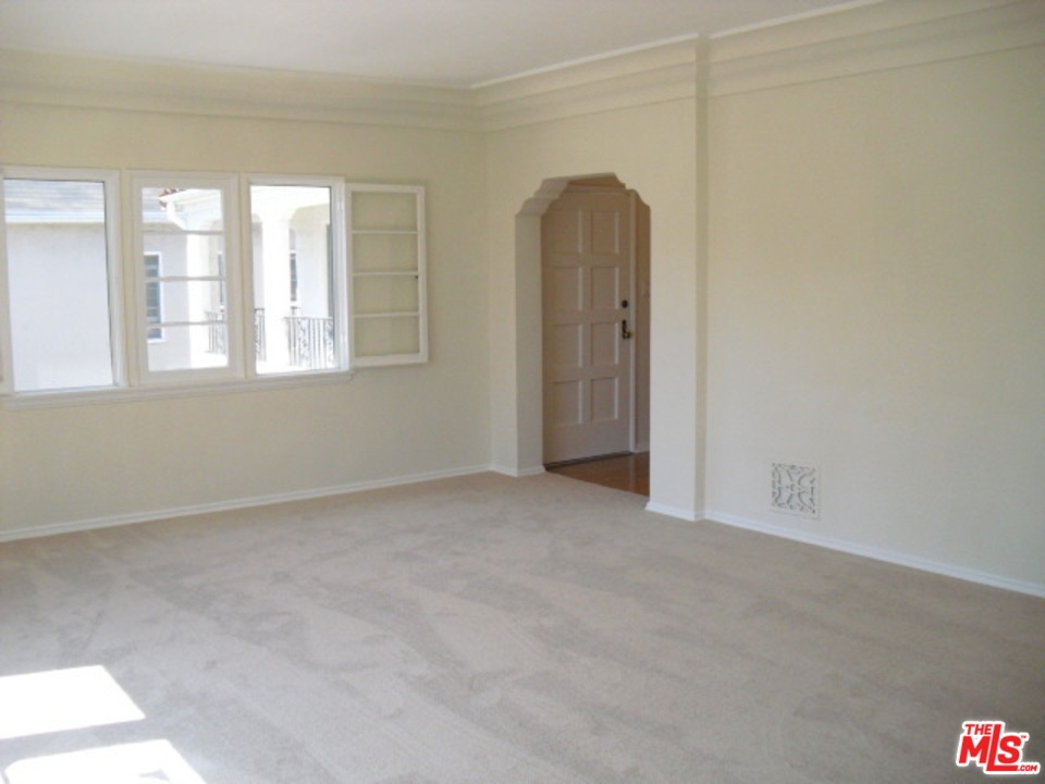 9963 Durant Drive Beverly Hills, CA 90212 - Photo 6 of 23 an empty room with windows