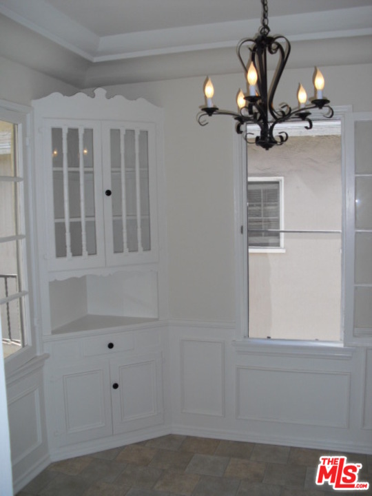 9963 Durant Drive Beverly Hills, CA 90212 - Photo 9 of 23 a view of a livingroom with a chandelier