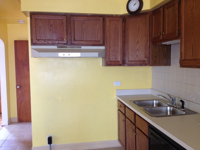 2229 Keystone Avenue North Riverside, IL 60546 - Photo 3 of 9 a kitchen with a sink and a refrigerator