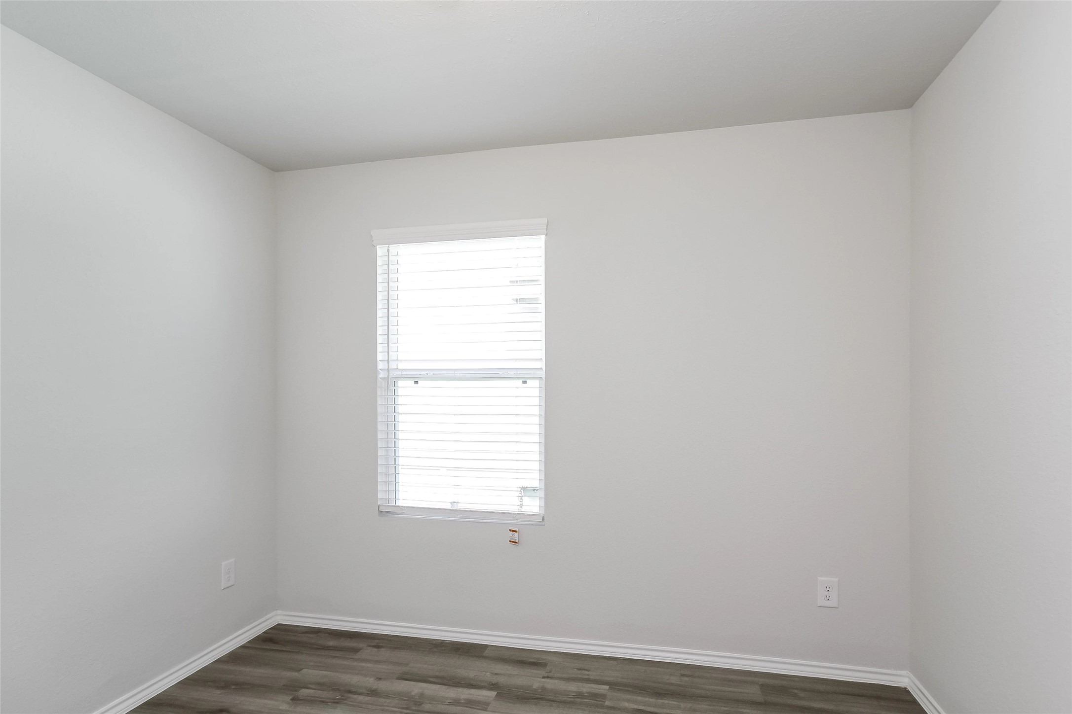 22382 Clear Castle Drive Porter, TX 77365 - Photo 11 of 14 an empty room with wooden floor and windows