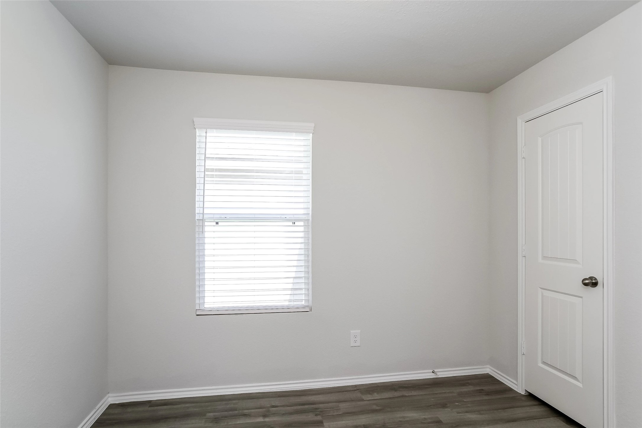 22382 Clear Castle Drive Porter, TX 77365 - Photo 10 of 14 a view of an empty room with wooden floor and a window
