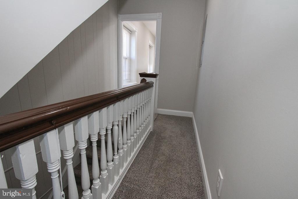 700 Main Street Red Hill, PA 18076 - Photo 11 of 14 a view of a hallway with wooden floor and staircase