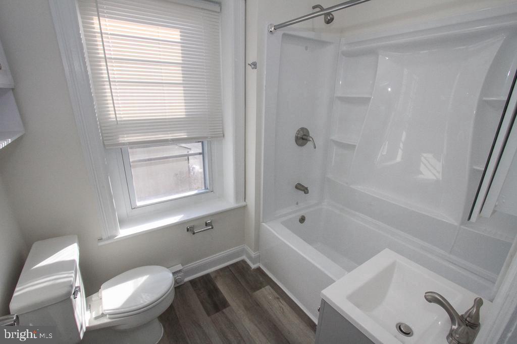 700 Main Street Red Hill, PA 18076 - Photo 5 of 14 a bath room with a toilet a bath tub and a sink
