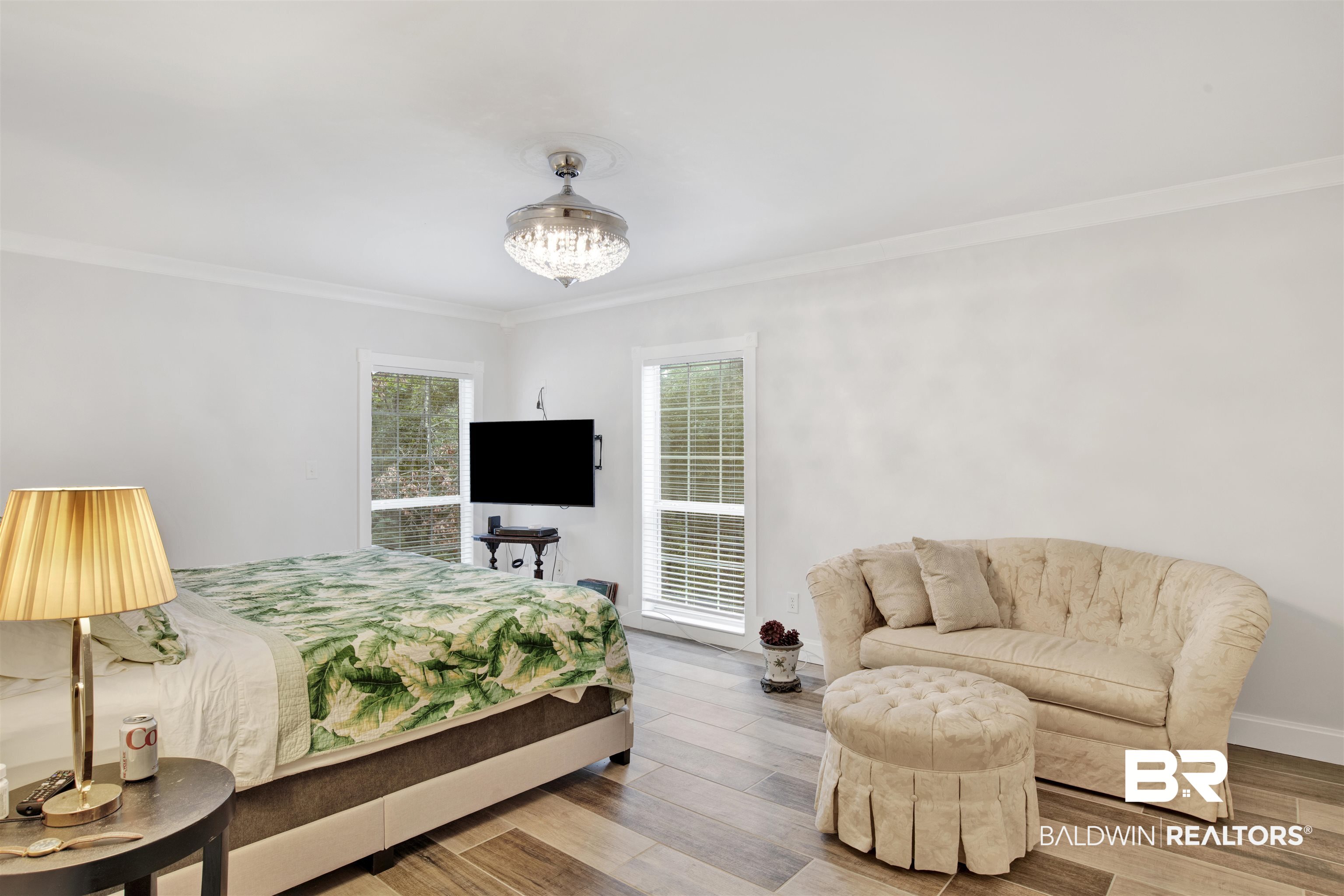 7641 Hitt Road Mobile, AL 36695 - Photo 15 of 29 Bedroom featuring ornamental molding, light wood-type flooring, and a chandelier