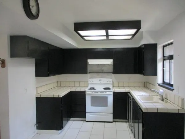 a kitchen with a stove and a fireplace