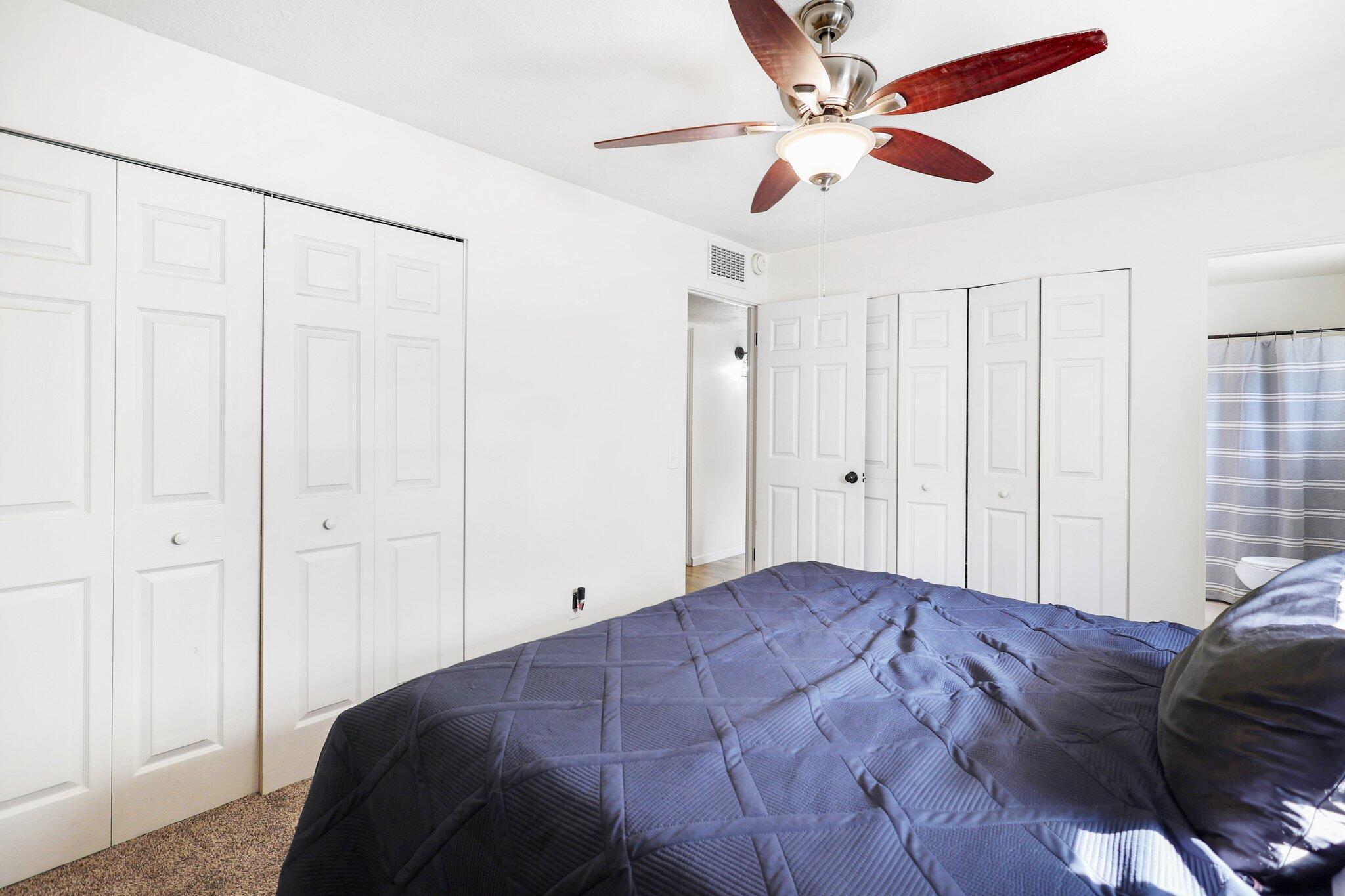 140 Chestnut Avenue Red Bluff, CA 96080 - Photo 12 of 26 a bedroom with a bed and a ceiling fan