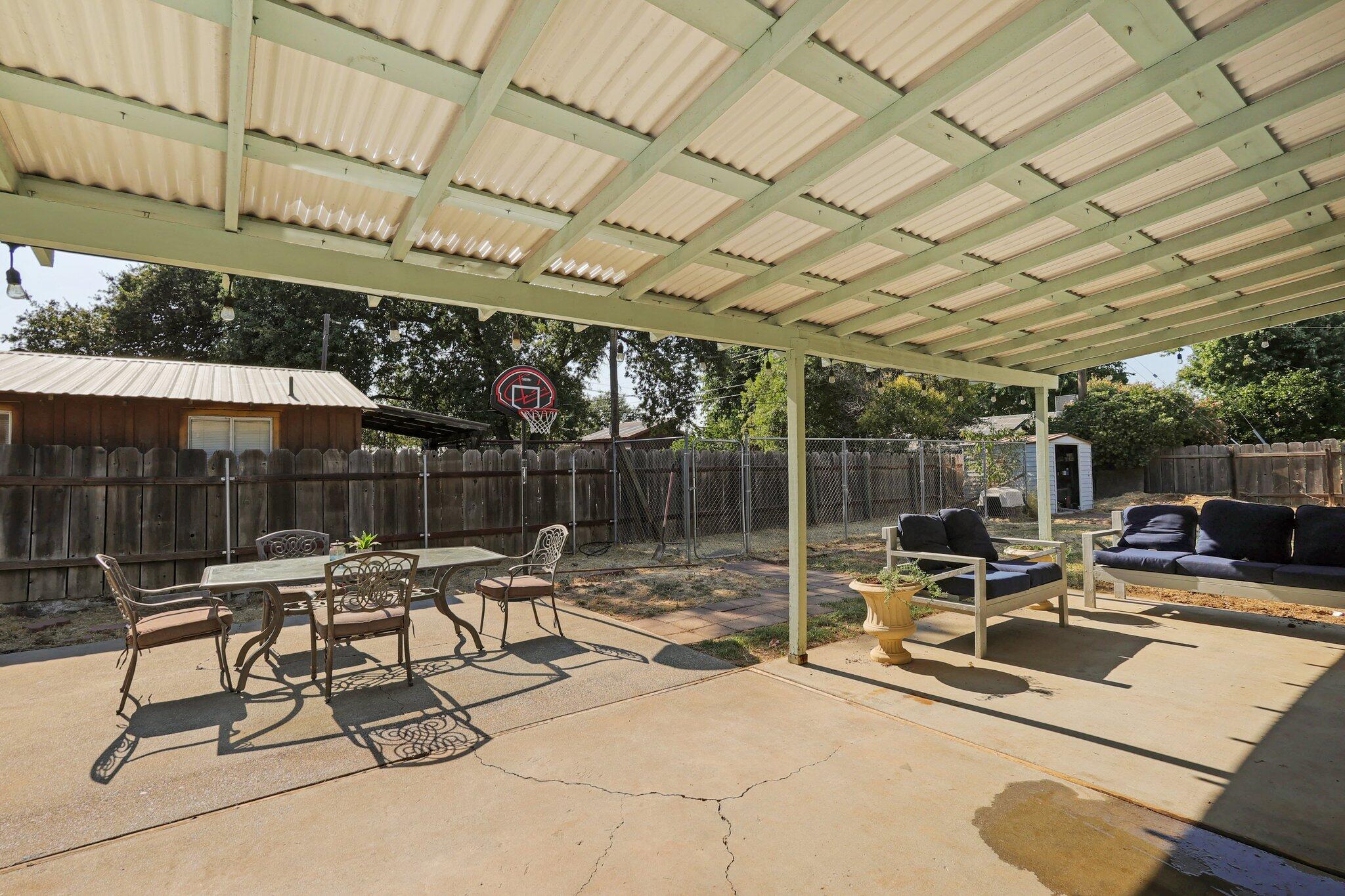 140 Chestnut Avenue Red Bluff, CA 96080 - Photo 20 of 26 a building outdoor space with patio furniture and potted plants