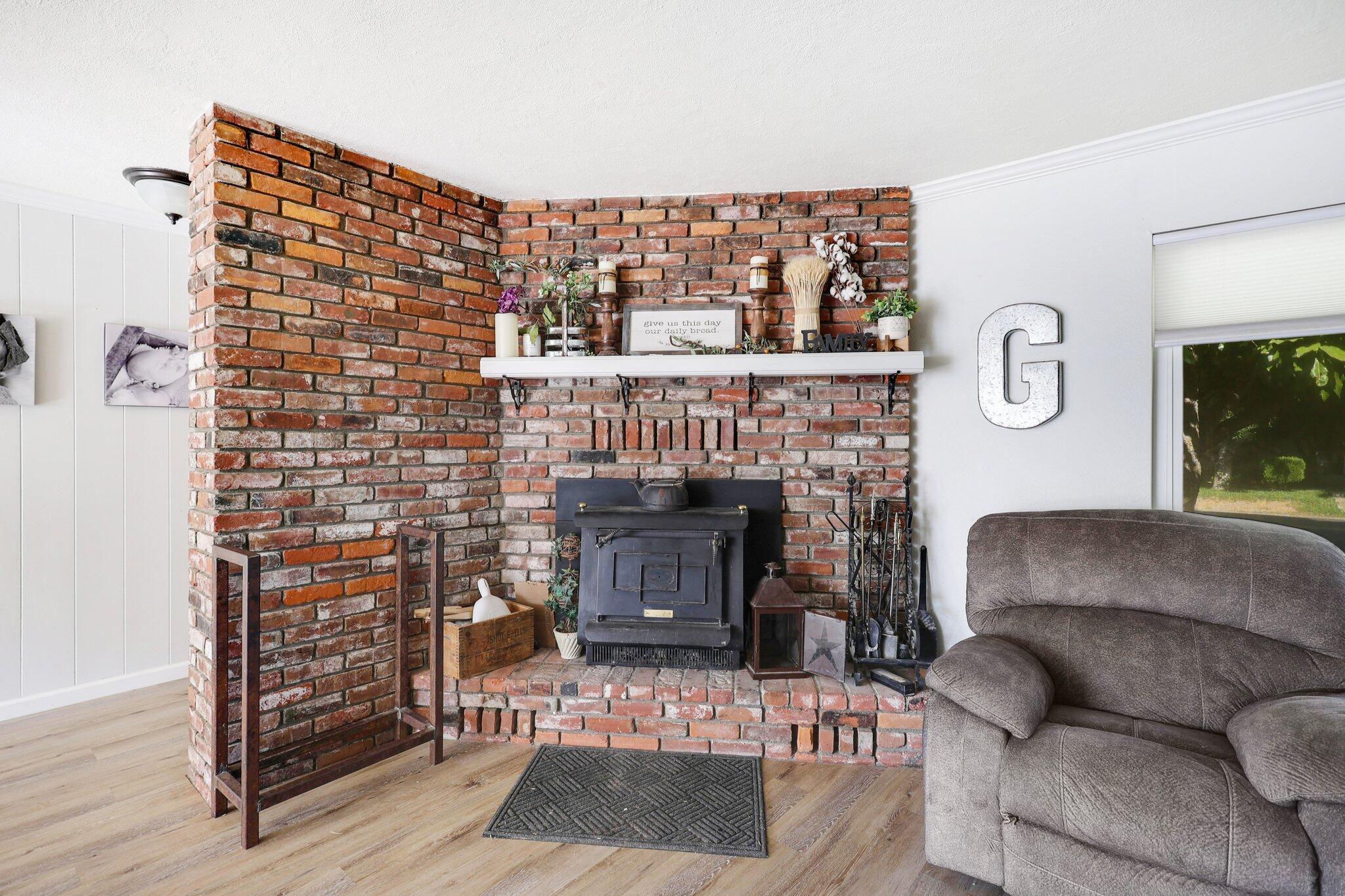 140 Chestnut Avenue Red Bluff, CA 96080 - Photo 4 of 26 a living room with furniture and a fireplace